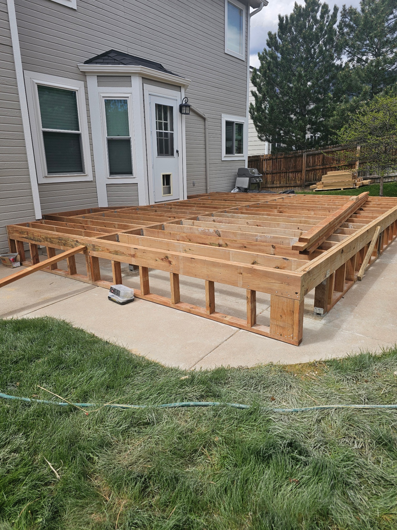 Before — Bare Patio → Composite Deck with Railing